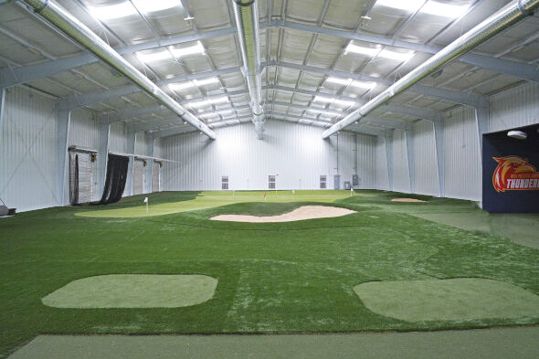 Augusta indoor putting facility with tee boxes